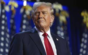 Republican presidential nominee former President Donald Trump arrives at an election night watch party at the Palm Beach Convention Center, Wednesday, Nov. 6, 2024, in West Palm Beach, Fla. 