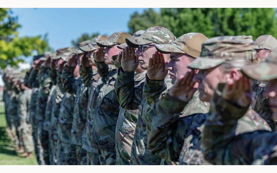 The Idaho National Guard’s citizen-soldiers salute during the singing of the National Anthem at the change of command ceremony transferring authority between outgoing commander, Michael J. Garshak, and the incoming commander, Maj. Gen. Timothy J. Donnellan, at Gowen Field on Tuesday, June 25, 2024.