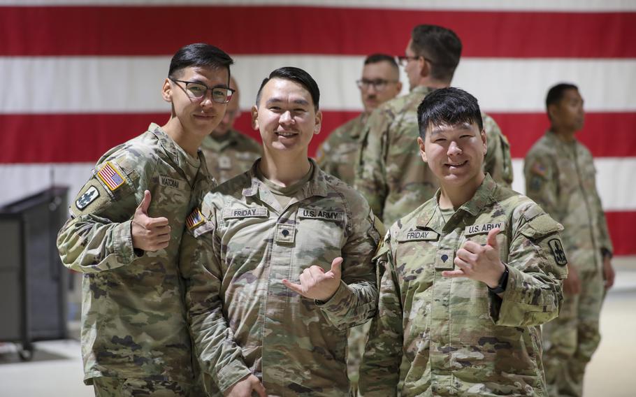 From left, Alaska Army Guard Spc. Xavier Matchian, Spc. Nathaniel Friday and Spc. Jade Friday, all infantryman with Bravo Company, 1st Battalion, 297th Infantry Regiment, celebrate together during a welcome home event at the Alaska National Guard Readiness Center on Joint Base Elmendorf-Richardson, Aug. 10, 2024. 