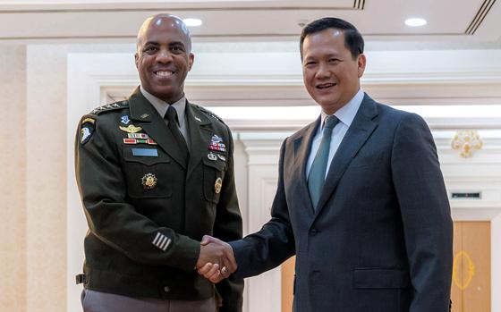 In this photo released by Agence Kampuchea Press (AKP), Cambodian Prime Minister Hun Manet, right, shakes hands with Gen. Ronald P. Clark, left, the commanding general of U.S. Army Pacific, left, during a welcome meeting at the Peace Palace in Phnom Penh, Cambodia, Monday, Feb. 24, 2025. (AKP via AP)