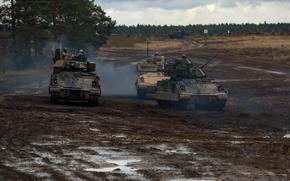 Army M2A3 Bradley Fighting Vehicles assigned to the 1st Cavalry Division participate in the Tumak 24 exercise at Bemowo Piskie Training Area, Poland, Nov. 20, 2024. The annual Reagan National Defense Survey revealed a 15 percentage point increase in American support for increased military spending.