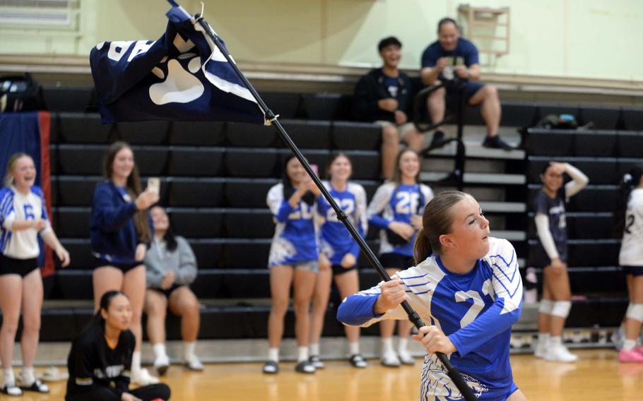 Brinn Hardt waves a flag.