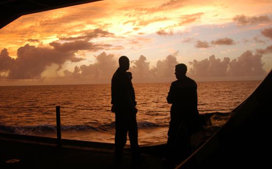 HED: Sunset over the Pacific, 2006

Off the coast of Guam, June 19, 2006: Sailors aboard the USS Ronald Reagan watch a sunset in waters outside Guam. The carrier is taking part in Valiant Shield, a new exercise involving three aircraft carrier groups carrying a combined 20,000 personnel, 28 ships and 290 aircraft, making Valiant Shield the largest carrier exercise since the Vietnam conflict. 

Read more at: https://www.stripes.com/news/massive-armada-taking-part-in-carrier-exercise-near-guam-1.50626
Source - Stars and Stripes                              

Check out the 2006 story and see additional photos here:
https://www.stripes.com/migration/massive-armada-taking-part-in-carrier-exercise-near-guam-1.50626

META TAGS: U.S. Navy; Valiant Shield; Pacific Ocean;