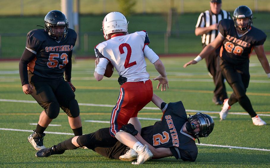 Zander Doulder of Spangdahlem tackles Alex Chapman of the International School of Brussels during a game on September 21, 2024 at Spangdahlem High School in Spangdahlem, Germany.