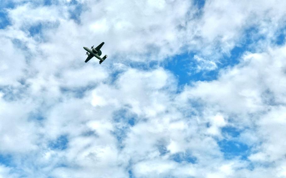 A Taiwan air force E-2 Hawkeye airborne early warning aircraft flies overhead.