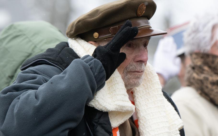 A veteran salutes during a ceremony