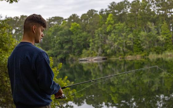 U.S. Marine Corps Lance Cpl. Kyle Baskin, combat photographer, Headquarters and Headquarters Squadron, casts a line at Scout Pond during the 4th Semi-Annual Fishing Derby at Marine Corps Air Station Beaufort, South Carolina, May 6, 2023. The fishing derby is a recreational event that tests service members and their dependents fishing skills and gives them a chance to meet new people. (U.S. Marine Corps photo by Sgt. Cheyeanne Campbell) 