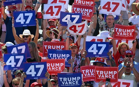 Supporters of former US President and Republican presidential candidate Donald Trump cheer as they wait for a campaign rally at the Aero Center in Wilmington, North Carolina, Sept. 21, 2024. (Jim Watson/AFP/Getty Images/TNS)