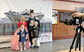 A 2nd Combat Aviation Brigade soldier and his family members pose in traditional Korean clothing during an event at Camp Humphreys, South Korea, Nov. 18, 2023.