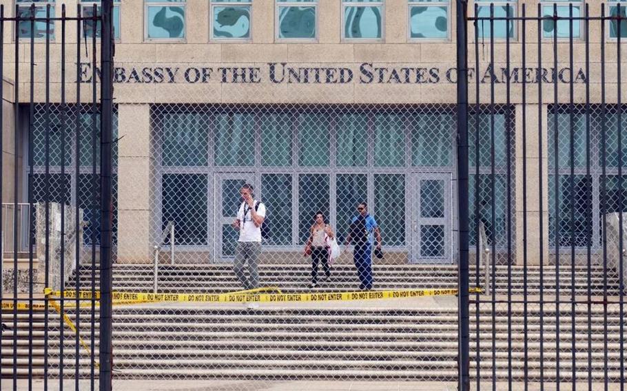 Workers at the U.S. Embassy in Havana leave the building on Sept. 29, 2017, after the State Department announced that it was withdrawing all but essential diplomats from the embassy.