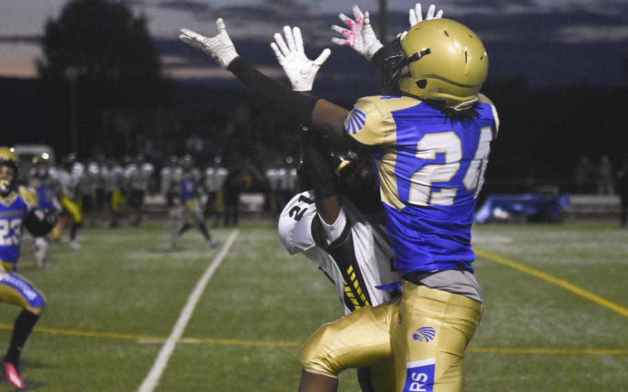 Wiesbaden freshman Zion Thompson jumps for a pass against Stuttgart defensive back Jeremyah Reyes on Sept. 13, 2024, in Wiesbaden, Germany. Thompson completed the catch for about a 30-yard gain. 