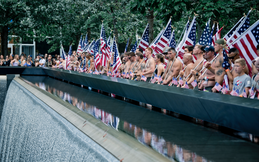 Swimmers gathered at the National September 11 Memorial in Lower Manhattan, New York after completing the Navy SEAL Swim. 