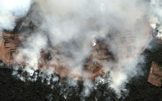 General view of the aftermath of a large series of explosion on an ammunition depot in Toropets, Russia, Wednesday Sept. 18, 2024. (Satellite image ©2023 Maxar Technologies via AP)