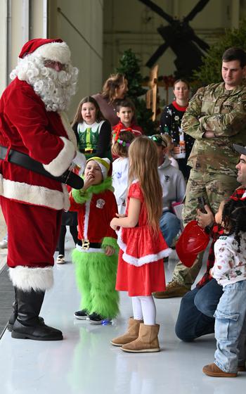 Santa greets children at  Barnes Air National Guard Base.