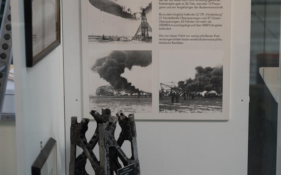 The explosion of the Hindenburg in Lakehurst, N.J., on May 6, 1937, is shown in an exhibit at the Zeppelin Museum in Neu-Isenberg, Germany. The disaster left 36 people dead and marked the end of the airship era. A piece of the mooring tower and a bow lamp from the Hindenburg are displayed at the museum. 