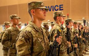 U.S. Air Force Basic Military Training trainees carry M4 rifles at Joint Base San Antonio-Lackland, Texas, on Aug. 2, 2024.  The reintroduced weapons program emphasizes constant weapon handling throughout basic training.