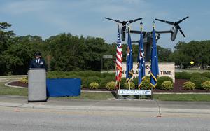 U.S Air Force Lt. Col. John Campion, executive officer for U.S. Air Force Lt. Gen. Tony Bauernfeind, prepares to begin a Distinguished Flying Cross ceremony at Voas-Lackey Roundabout, Hurlburt Field, Fla. , May 16, 2024. U.S. Air Force Maj. Randell Voas, a CV-22B Osprey pilot, and Senior Master Sgt. James Lackey, a CV-22B flight engineer, were awarded the DFC for actions taken during a combat mission near Qalat, Afghanista, April 9, 2010. 