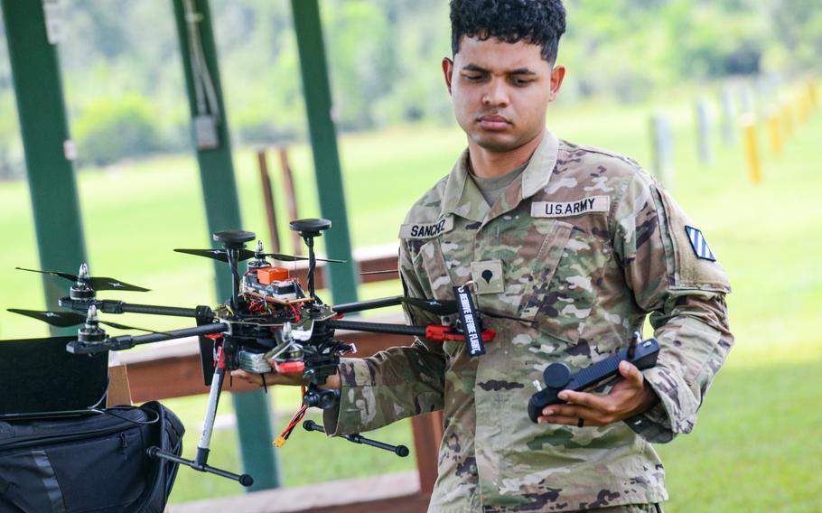 Army Spc. Adonis Sanchez prepares to fly a drone that he built during a small drone building class at Fort Stewart at a small airfield just off the Georgia Army post on July 26, 2024. The 3rd Infantry Division soldier was part of the inaugural drone building class run by the division’s Marne Innovation Center. 