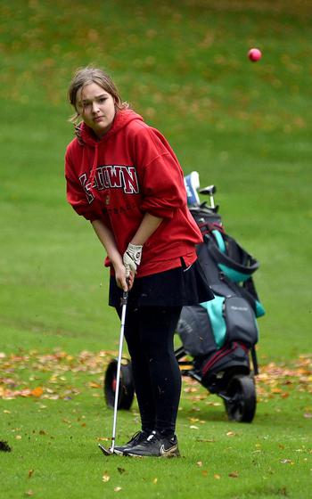 Mackenzie Dager hits off the fairway.