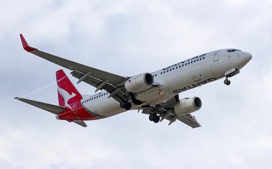 A Boeing Co. 737 aircraft operated by Qantas Airways Ltd. approaches to Sydney Airport in Sydney, Australia, on Tuesday, Feb. 20, 2024. MUST CREDIT: Brendon Thorne/Bloomberg