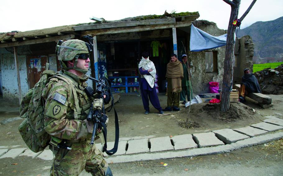 Sgt. Wesley Timbrook, 24, of Coweta, Okla., patrols through the main bazaar