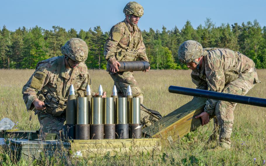 Army paratroopers prepare ammunition for a M119 105mm howitzer at the 7th Army Training Command’s Grafenwoehr Training Area in Germany in 2018. 