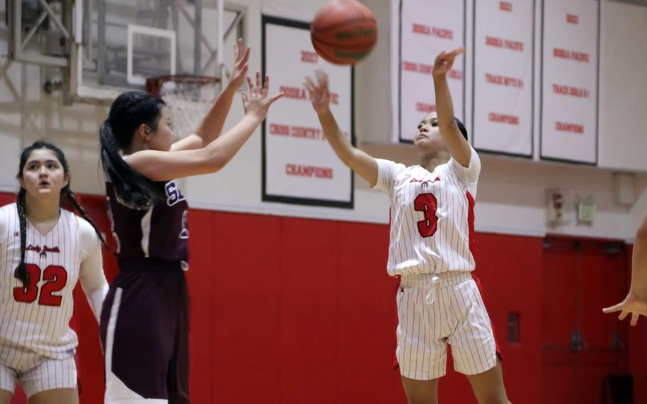 Lindsey Andrade tries to steal the ball.