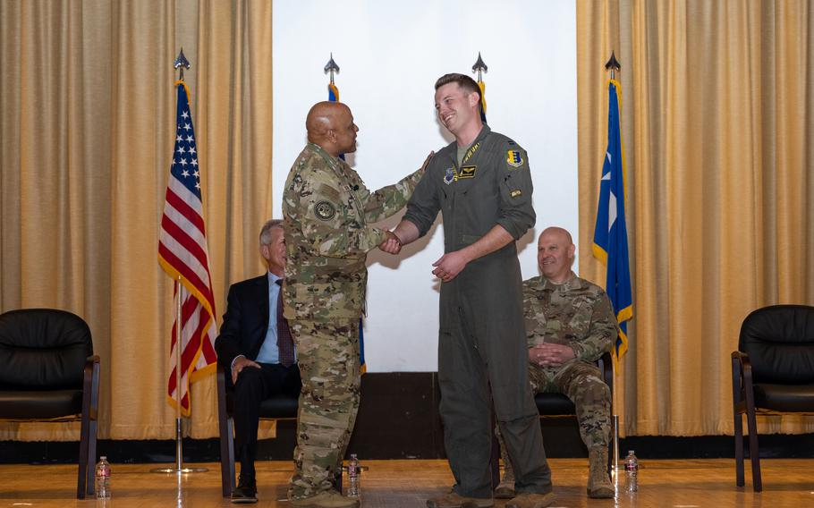 The Tigers of the 37th Bomb Squadron roared into history when Gen. Anthony Cotton, U.S. Strategic Command commander, left, presented the unit with the 2022 Omaha Trophy during a special event April 21, 2023, at Ellsworth Air Force Base for being the best strategic bomber squadron.