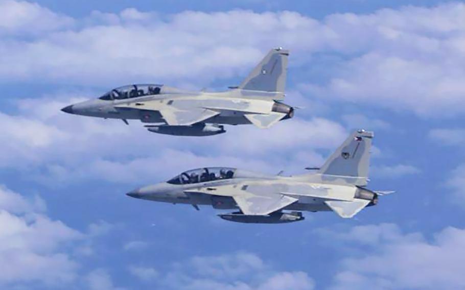 Two FA-50 fighter jets fly. 