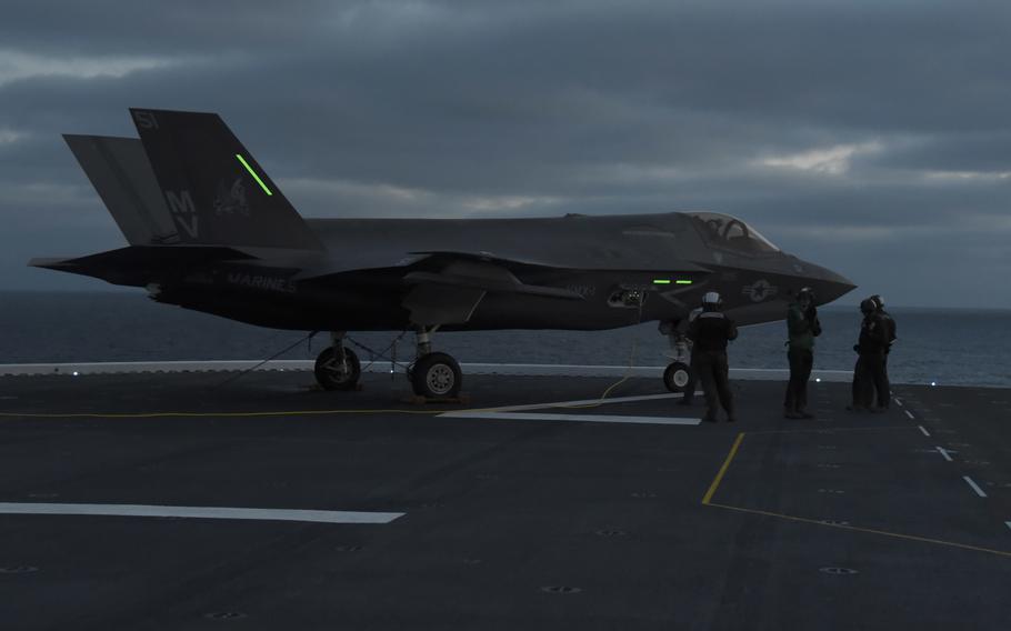 An F-35B Lightning II attached to Marine Operational Test and Evaluation Squadron (VMX) 1 idles on the flight deck of amphibious assault ship USS Tripoli (LHA 7) during night flight operations Jan. 19, 2024. 