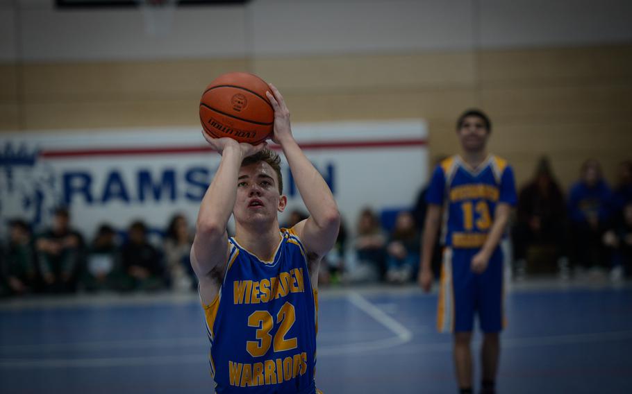 Wiesbaden Warrior Colin Moore aims a free throw against Stuttgart during the DODEA European Division I boys basketball championships Feb. 16, 2023, at Ramstein Air Base, Germany. 