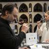 Wine Styles owner Arthur Lampros, left, and Valentyna Parsaieva, head of export for Shabo, a Ukrainian winery, right, take part in a wine tasting at Wine Styles, Dec. 20, 2024 in Dumfries, Va. (AP Photo/Kevin Wolf)