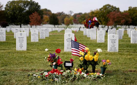 FILE - Flowers rest at the burial plot of former Secretary of State ...