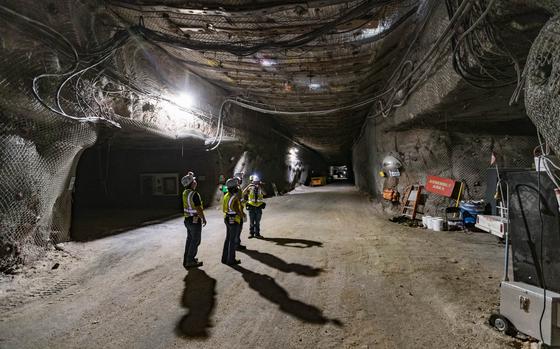 A tour group walks in a geological repository, U.S. Department of Energy's Waste Isolation Pilot Plant, storing transuranic radioactive waste in the desert between Hobbs and Carlsbad on Tuesday, Aug. 17, 2021