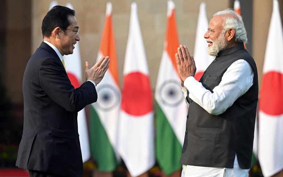 Japan's Prime Minister Fumio Kishida, left, and his Indian counterpart, Narendra Modi, before their meeting at the lawns of the Hyderabad House in New Delhi, India, on Saturday, March 19, 2022. 