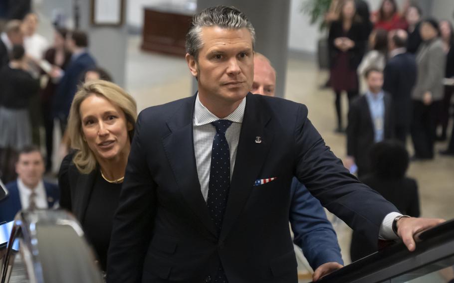 Pete Hegseth and his wife Jennifer Rauchet on an escalator at the Capitol.