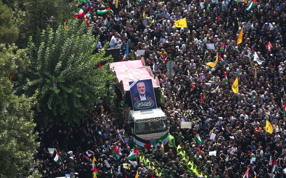 In this handout image from the Office of the Iranian Supreme Leader, people gather during a funeral procession for Ismail Haniyeh, the political leader of Hamas and his bodyguard who were killed in an assassination on Aug. 1, 2024, in Tehran, Iran. 