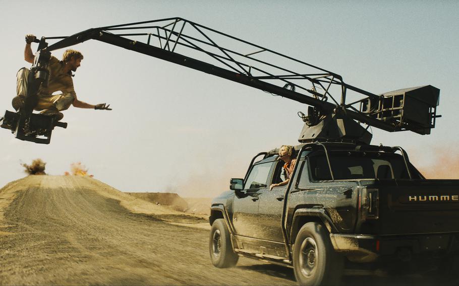 Ryan Gosling, left, and Emily Blunt, right, in a scene from “The Fall Guy.” Gosling proudly announced what few actors do: He did not do his own stunts for the film.