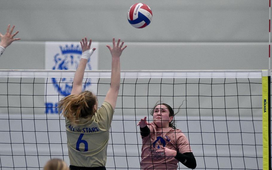 Vilseck junior Sophie Fedorisin of the Pink team hits the ball over SHAPE junior Johana Borocova of the Gold team during the 2024 DODEA-Europe All-Star volleyball matches on Nov. 9, 2024, at Ramstein High School on Ramstein Air Base, Germany.