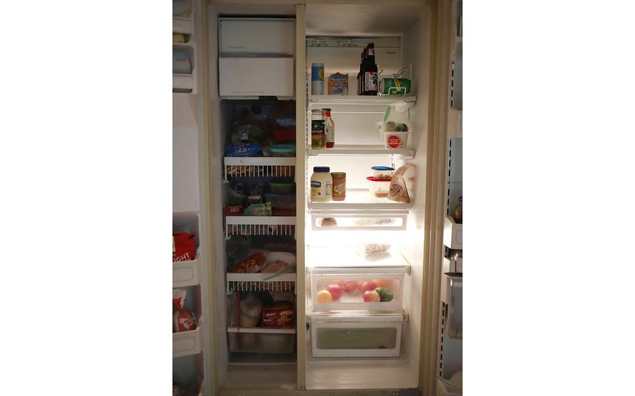 Scott Carothers’s refrigerator and freezer in Louisville, Ky. “The freezer side has a lot of stuff in it. The fridge side has a lot of nothing in it. Well, condiments,” he said.