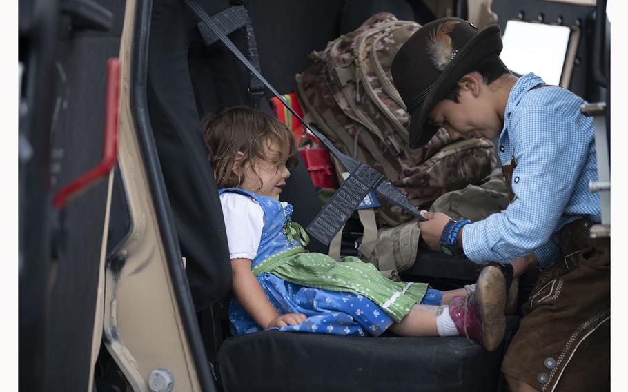 A local family takes a tour of a military vehicle at the 63rd Annual German-American Volksfest on Camp Algiers, Grafenwoehr, Germany from August 2-4, 2024. 