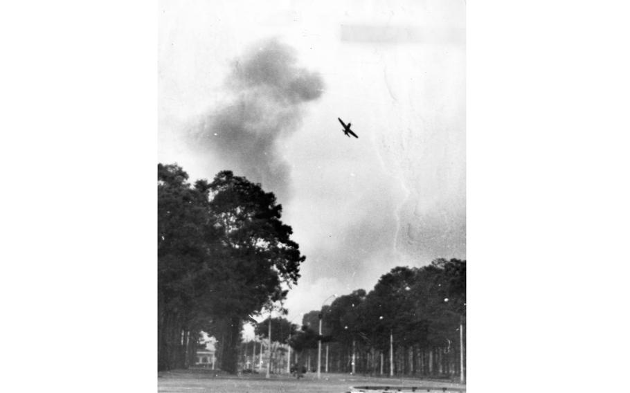 One of the two AD-6 Skyraider fighter bomber — piloted by rebellious Republic of Vietnam Air Force pilots — can be seen swooping over the Presidential Palace