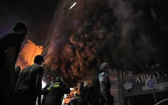 Smoke rises from a shop hit by an Israeli airstrike in Beirut.