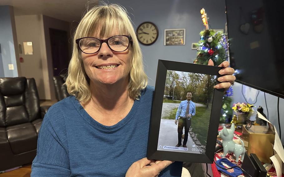 Stacey Collins Gardiner holds a picture of her son, Travis Timmerman, in her home in Urbana, Mo., Thursday, Dec. 12, 2024. Timmerman, an American citizen, was found outside Damascus, Syria, after having been imprisoned for months after crossing from Lebanon into Syria on a Christian pilgrimage. 