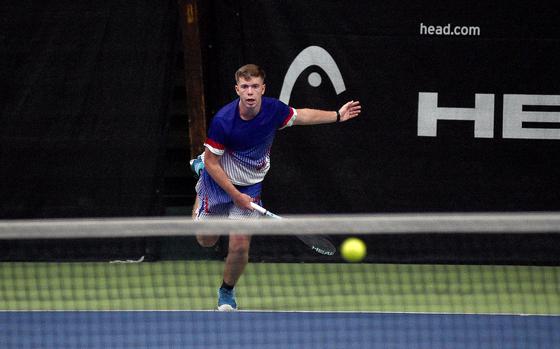 Ramstein's Tristan Chandler watches his serve as it crosses the net in a boys semifinal match against SHAPE's Alejandro Cuesta during the DODEA European tennis championships on Oct. 20, 2023, at T2 Sports Health Club in Wiesbaden, Germany.