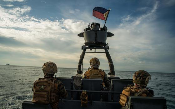 Members of the Philippine navy's elite special operations forces conduct a vessel capture exercise off the coast of Zamboanga.  MUST CREDIT: Martin San Diego for The Washington Post