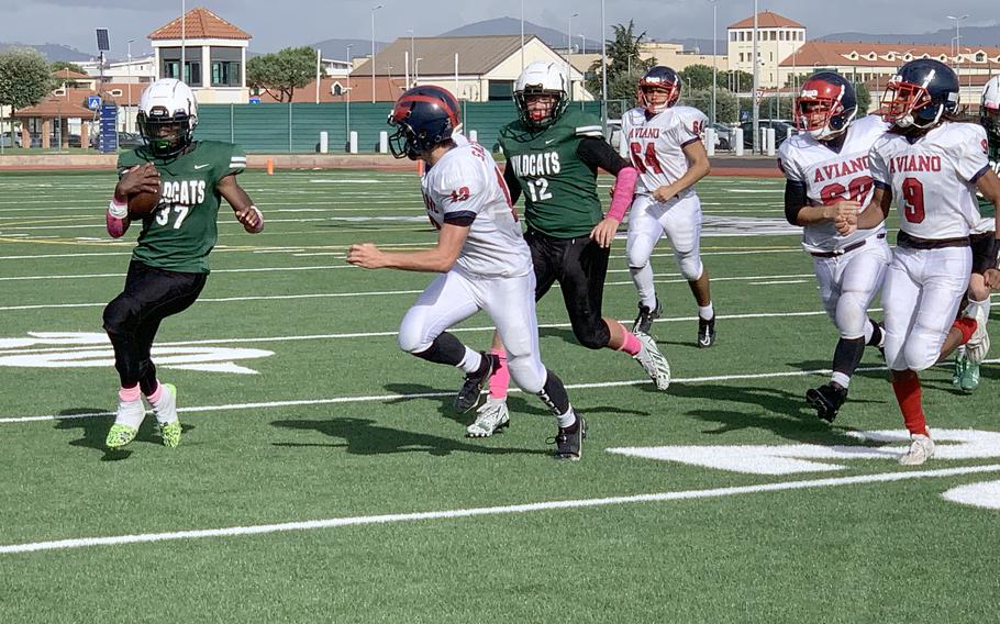 Naples running back Robert Oliver carries the ball for the Wildcats. Oliver ultimately scored two touchdowns, carrying 26 times for 77 yards, to help Naples clinch the DODEA European Division II title, 21-14 against Aviano on  Saturday, Oct. 21, 2023. 