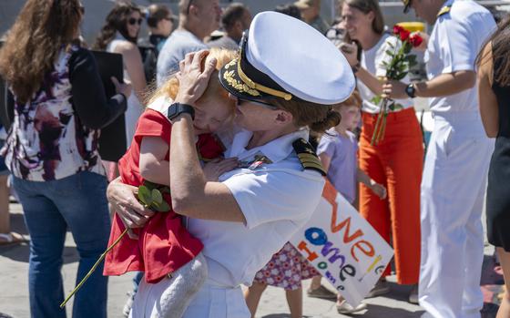 Lt. Cmdr. Megan E. Ricker, executive officer of the Independence-variant littoral combat ship USS Manchester (LCS 14), greets a loved one during a homecoming ceremony on Naval Base San Diego, Sept. 11, 2024. Manchester returned to Naval Base San Diego following an 18-month deployment to the U.S. 3rd and 7th Fleets in support of a free and open Indo-Pacific. Littoral Combat Ships are fast, optimally manned, mission-tailored surface combatants that operate in near-shore and open-ocean environments, winning against 21st-century coastal threats. (U.S. Navy photo by Mass Communications 2nd Class Isaak Martinez)