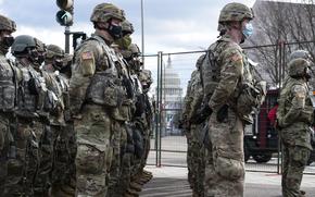 U.S. Soldiers with the Indiana National Guard National Guard provide security during the 2021 inauguration in Washington, D.C., Jan. 20, 2021. At least 25,000 National Guard men and women have been authorized to conduct security, communication and logistical missions in support of federal and District authorities leading up and through the 59th Presidential Inauguration. (U.S. Army National Guard photo by Sgt. Tackora Hand)