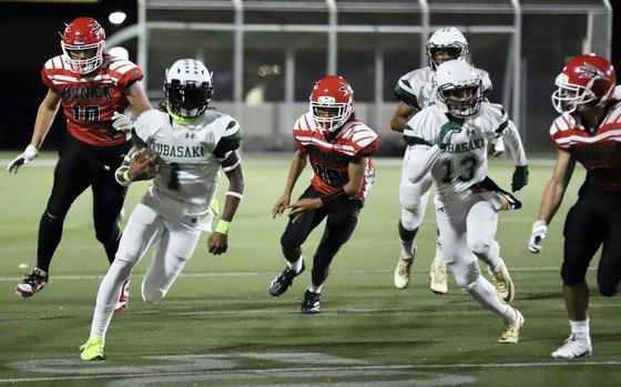 Carlos Cadet (1) is Kubasaki's quarterback and one of three threats out of the Dragons backfield.